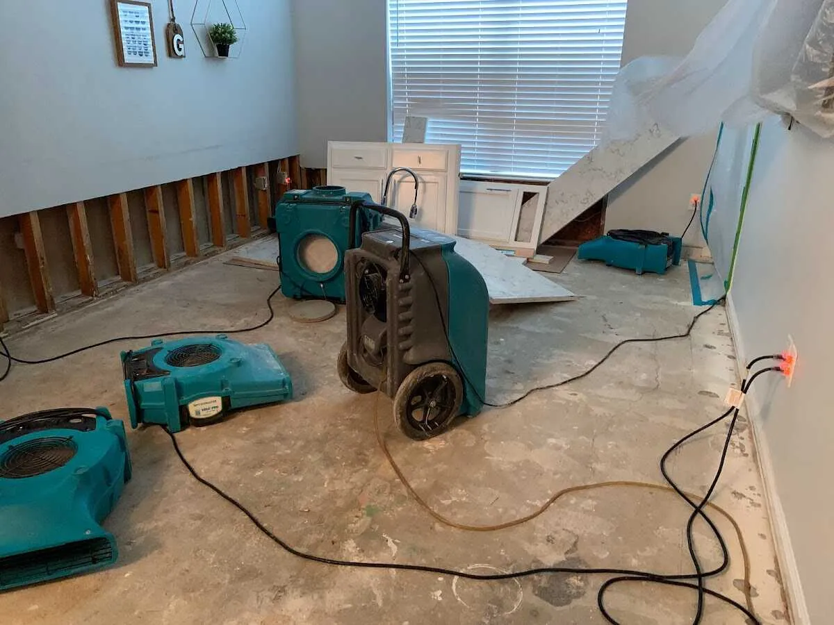 Dehumidifier in flood-cut room for Water Damage Restoration in Roy
